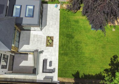 Six bedroom bespoke build Buckinghamshire - Aerial view of the rear garden and patio area image